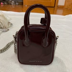 Charles and Keith burgundy red patent bag